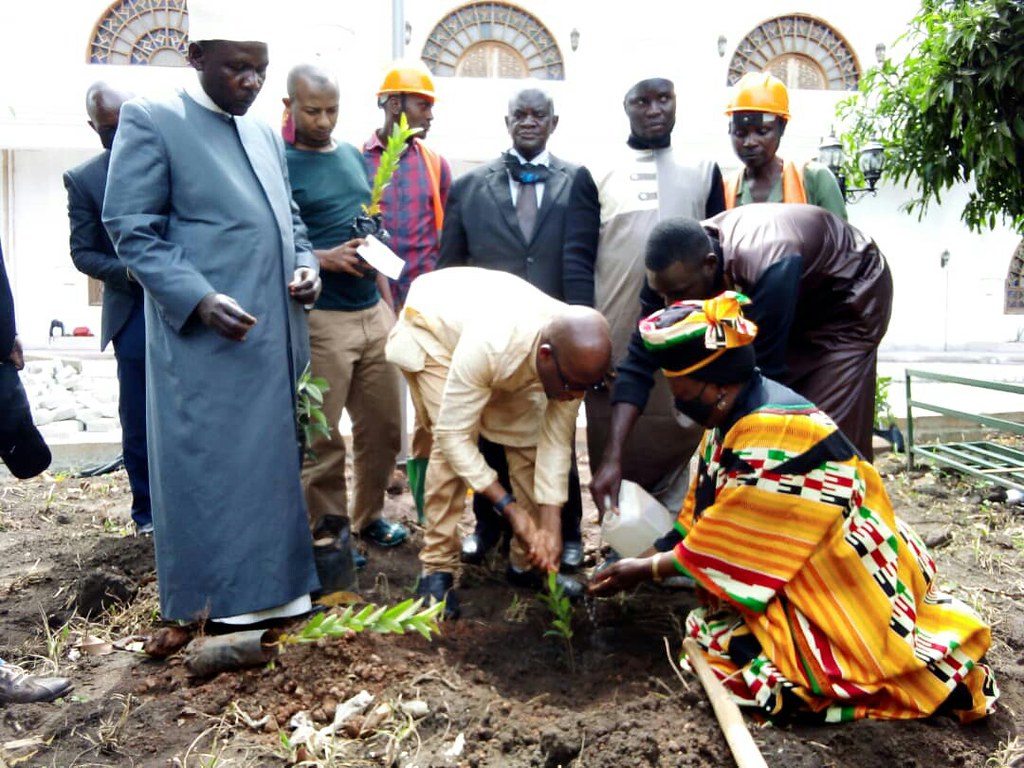 Greening Friday 2022 at the Uganda Muslim Supreme Council. The Executive Director of Uganda's National Enviroment Management Authority (NEMA) plants a symbolic tree with Hajjat Sebyala, director of Energizing Solutions, along with other supreme council dignitaries.