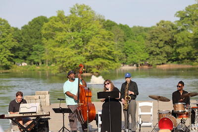 Andy plays the keyboard as part of a musical Easter Vigil in the park overlooking a lake